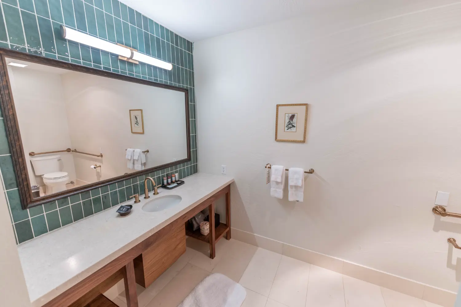 Superior King Accessible Bathroom with Spacious Vanity Accessible bathroom with wide vanity, grab bars, and modern design in Prescott hotel